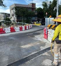 A person in a yellow hat standing on a road
AI-generated content may be incorrect.