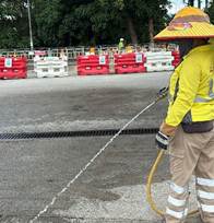 A person wearing a yellow hat and standing on a road

AI-generated content may be incorrect.
